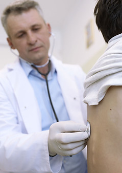 Doctor examines young patient