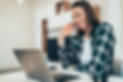 Beautiful young woman using laptop at home for online video call