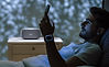 Man Using Smartphone before sleep