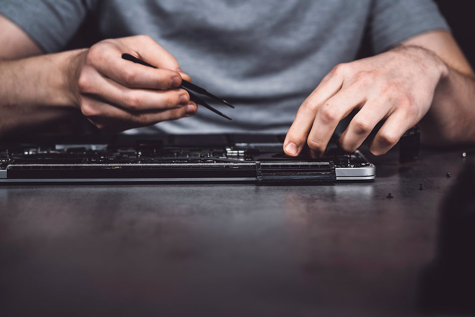 A man fixing the laptop