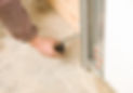 Close-up view of a person repairing the garage door