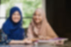 Two women wearing hijabs
