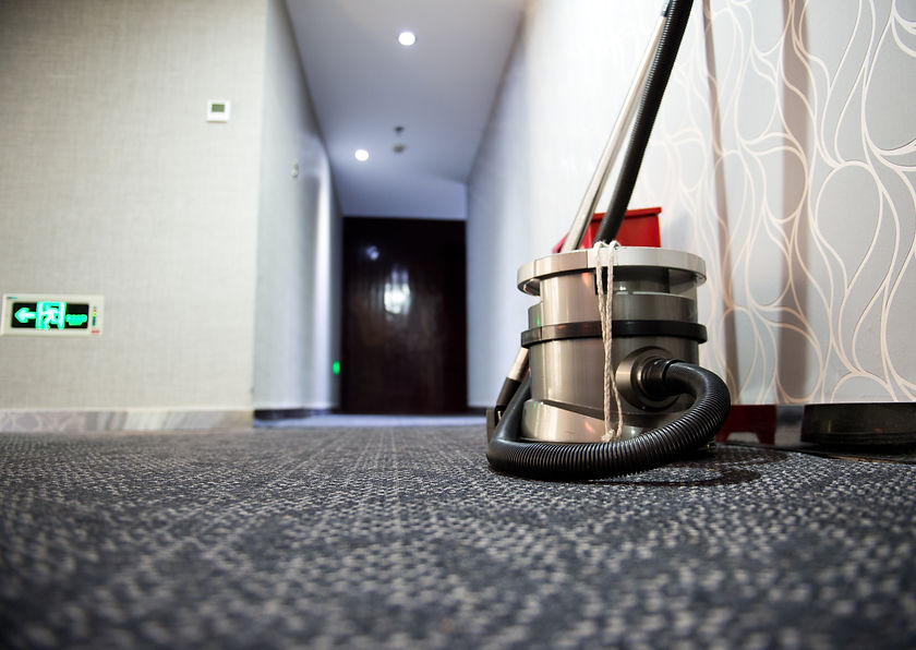 vacuum cleaner stands in the hotel corridor