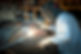 Welder working on metal surface