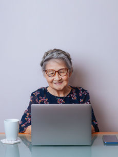 Elderly lady working on a laptop