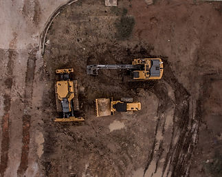 Active construction site with machinery moving soil — groundworks and development finance services by LivFinance.