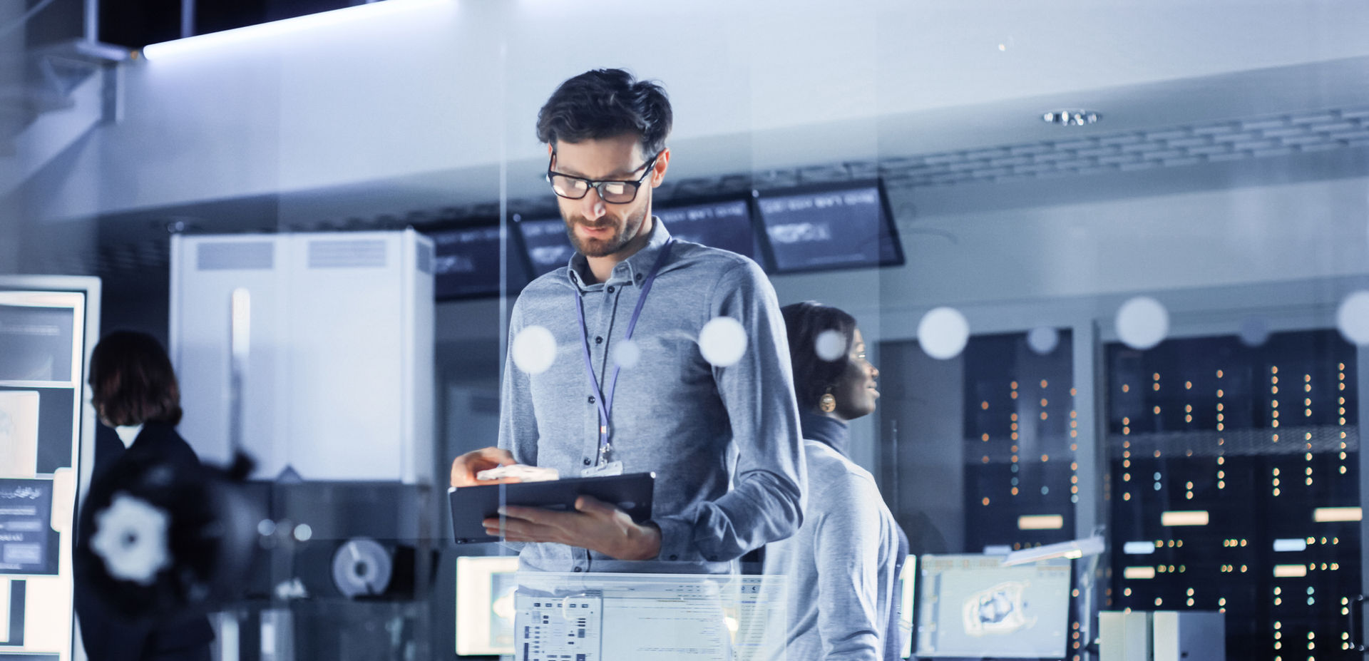 Man, Smartology's system architect, working on a laptop, showcasing expertise in home automation.