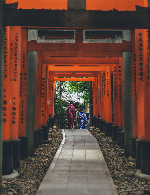 People Walking Through Shrine
