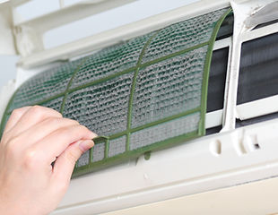 Close-up of a man’s hand doing the filtration of the air conditioning