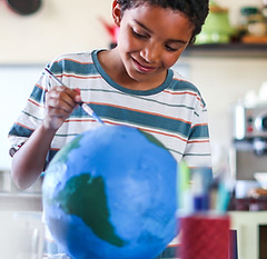 Boy Painting Globe