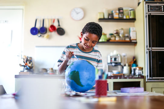 Boy Painting Globe