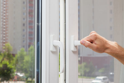 Man Hand opens a plastic pvc window