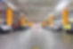 Parking garage, underground interior with a few parked cars