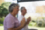 Meditating seniors outdoors