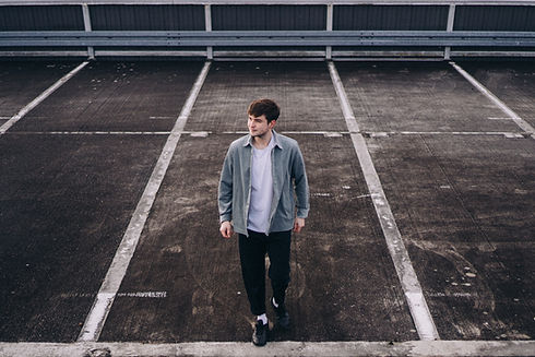 Male model posing in the parking lot