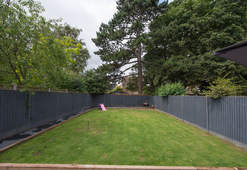 house garden with wooden fence