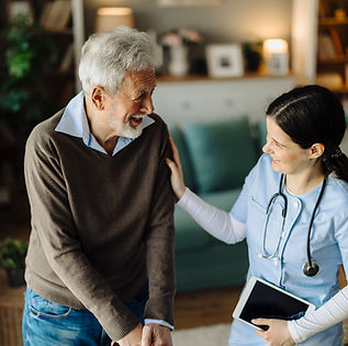 Nurse assisting elderly man
