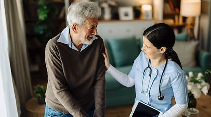 Nurse assisting elderly man