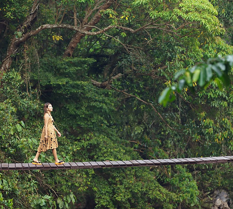 A woman walking on a bridge