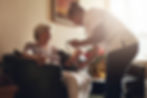 Nurse measuring blood pressure of senior woman patient in retirement home. Home caregiver