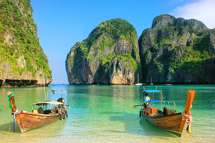 Two long tail boats at the beach