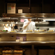 Cook checking order tickets in the kitchen