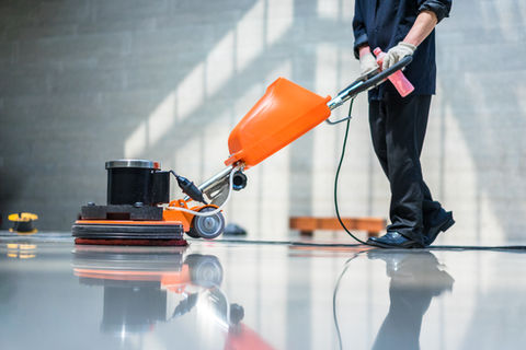An industrial floor polisher leaves the white marble shining and spotless.