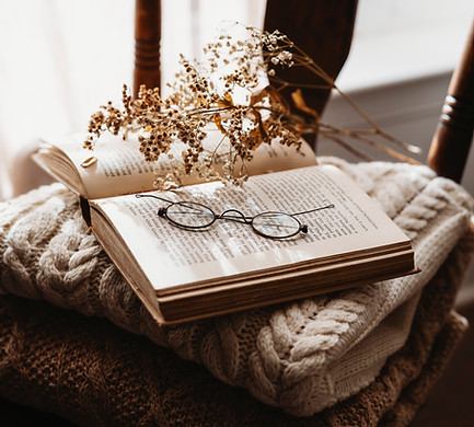 Book and Reading Glasses sitting on a Chair