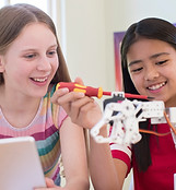 Girls Building Robot