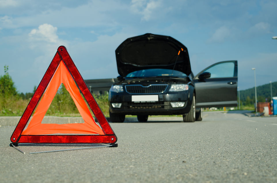 Car problem, warning triangle focused