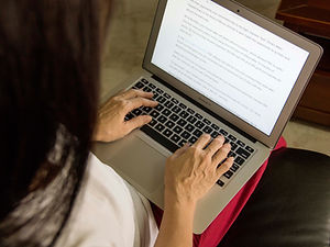 NEXYATEC technical marketing and content development services, showing a professional working on a laptop