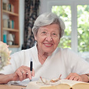 Elderly woman reads