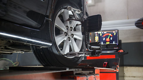 Car on stand with sensors on wheels for wheels alignment camber check in workshop of Service