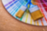 Paint brushes on pantone colour palette guide