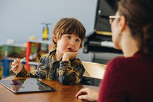 Child and caregiver working together during neurodiversity-affirming therapy for Pathological Demand Avoidance