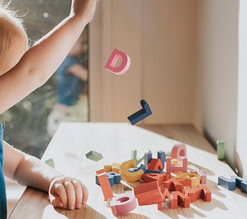 Playing with Wooden Alphabets