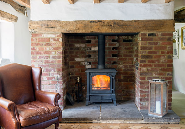 Armchair and fireplace in living room