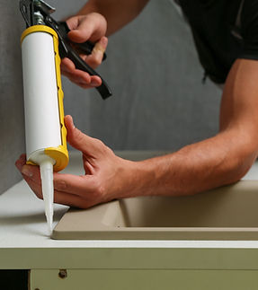 Applying Sink Sealant