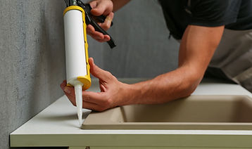 Applying Sink Sealant