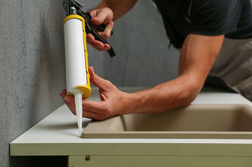 Applying Sink Sealant