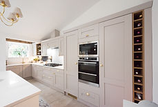 modern transitional kitchen featuring light taupe or beige shaker-style cabinetry