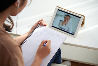 A woman studying online