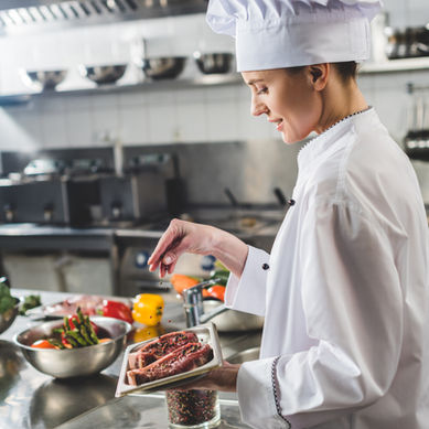 A chef hard at work at her job
