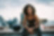 A Young Woman Sitting on a Balcony