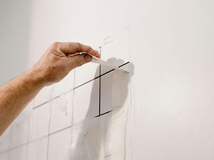 Professional flooring contractor installing tile in a commercial space.