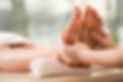 Close-up view of a woman getting a foot massage