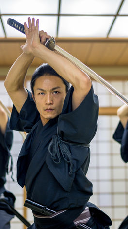 Japanese katana sword martial artists practicing a form