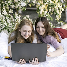 Lying under blossomed trees