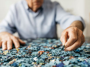 A person doing a puzzle.