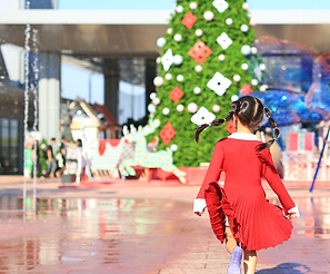 Child Running toward Christmas Tree